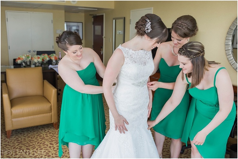 Bride getting into dress - Ottawa Marriott