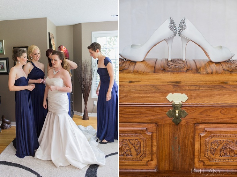Bride getting dressed with bridesmaids before ceremony