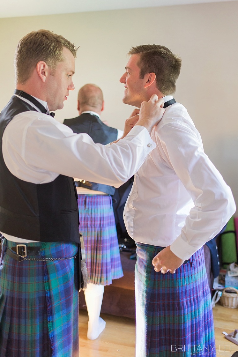 Groom and groomsmen getting ready for wedding in Kilts
