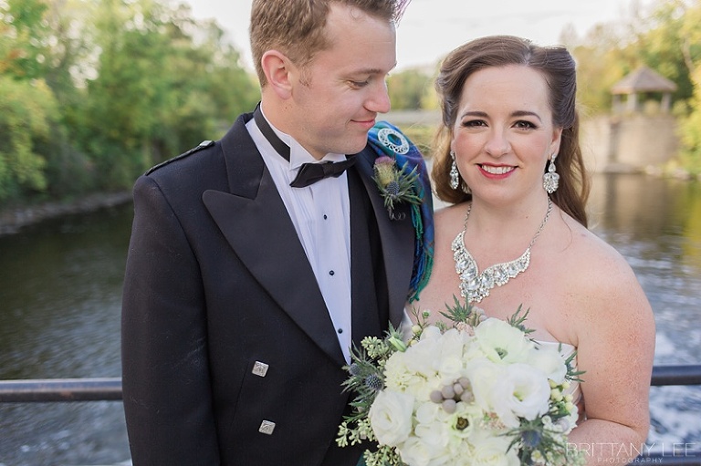 Bride in white dress and groom in Scottish kilt