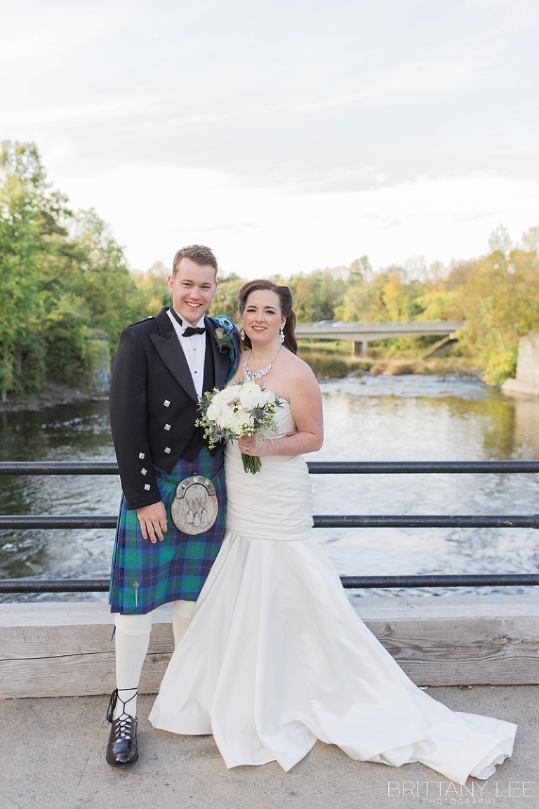 Bride in white dress and groom in Scottish kilt