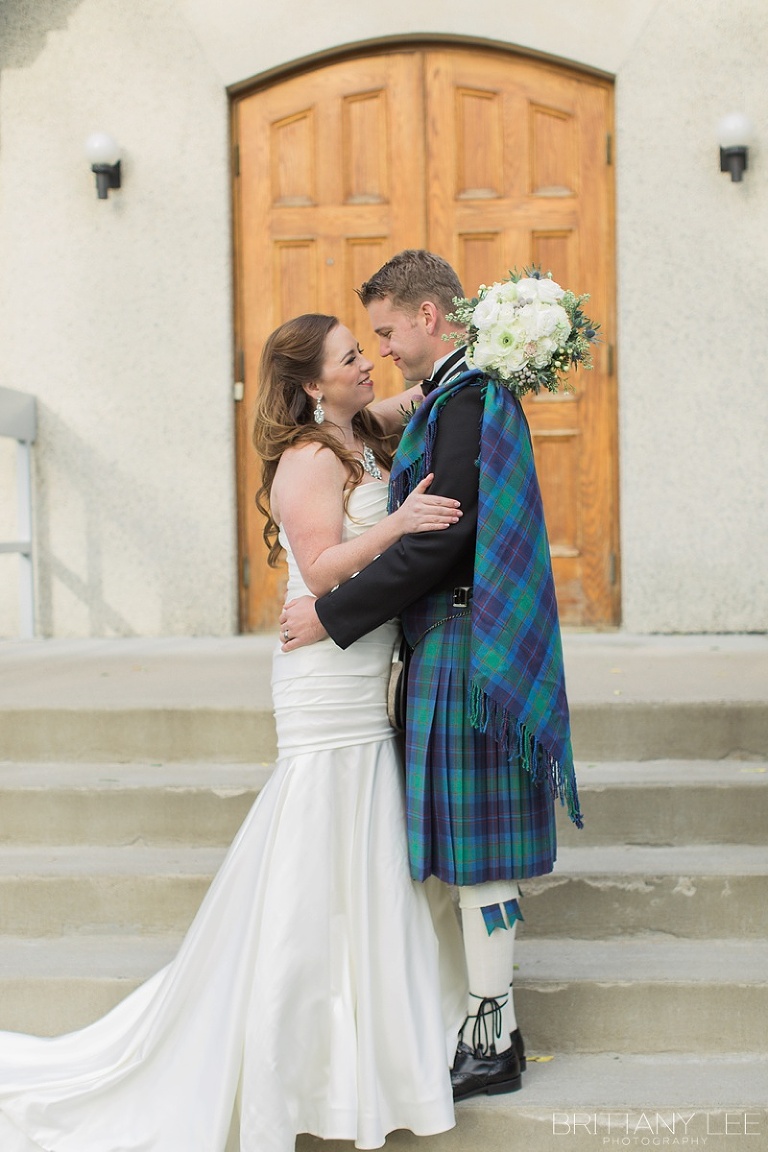 Bride in white dress and groom in Scottish kilt