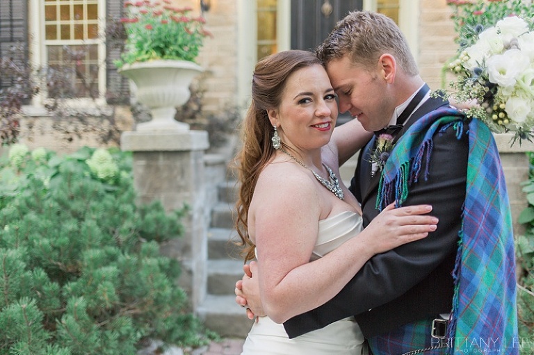 Bride in white dress and groom in Scottish kilt
