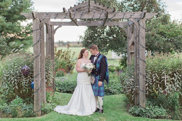 Bride in white dress and groom in Scottish kilt
