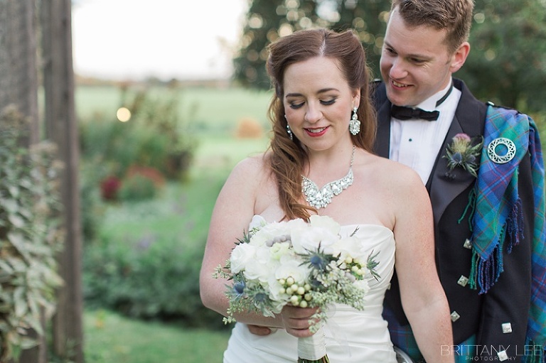 Bride in white dress and groom in Scottish kilt