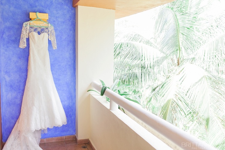 Bridal gown hanging in mexico resort wedding day