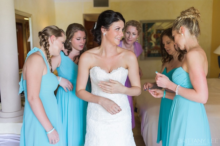 Bride getting dressed at Mexico destination wedding 