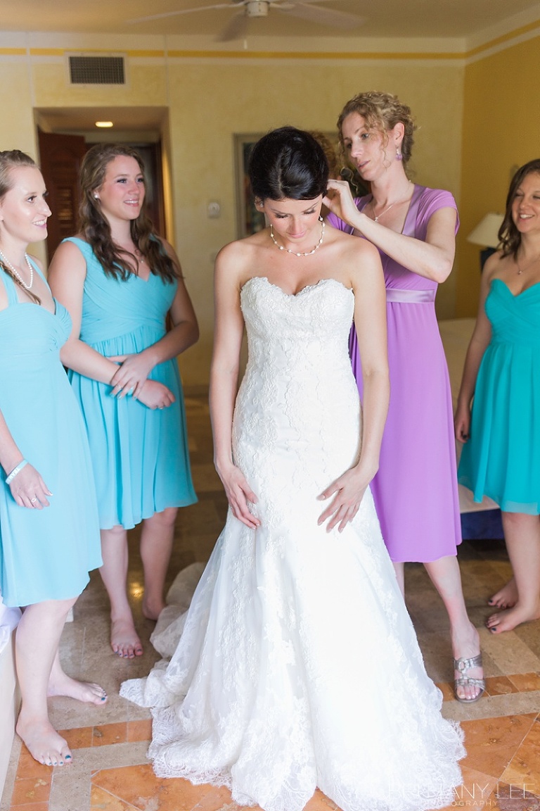 Bride getting dressed at Mexico destination wedding 