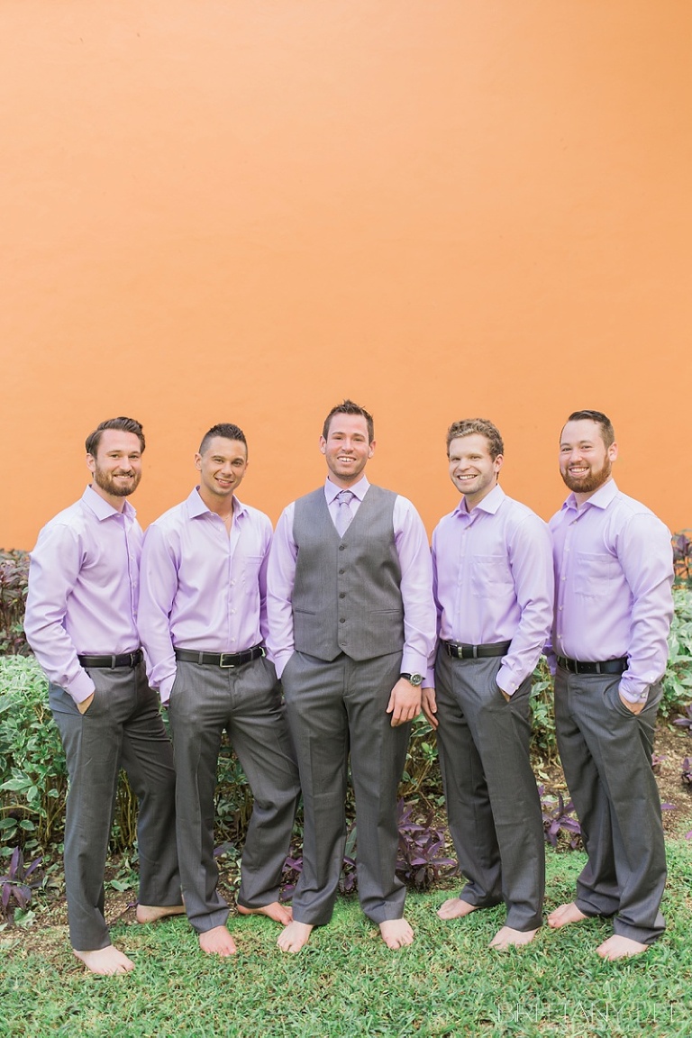 groom and groomsmen at destination wedding wearing purple