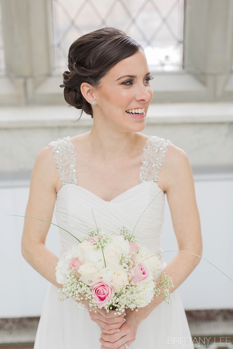 Bride holding bouquet during first look wedding photos at Museum of Nature