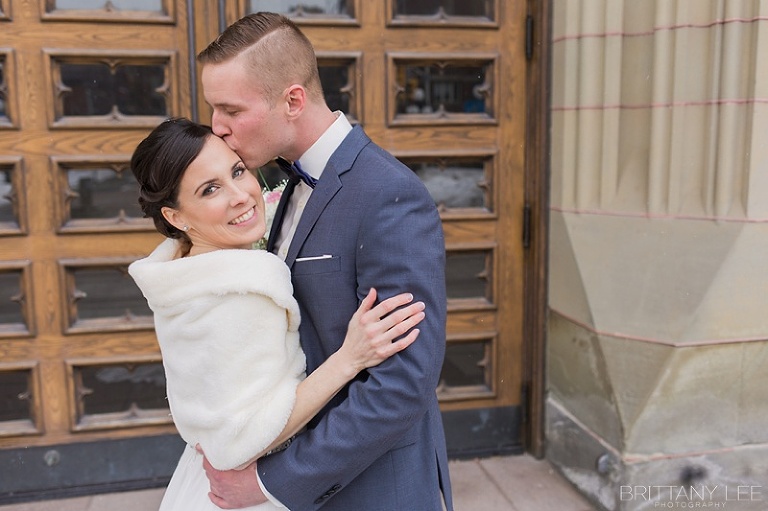 Bride and Groom kissing before wedding ceremony in Ottawa Lord Elgin Hotel