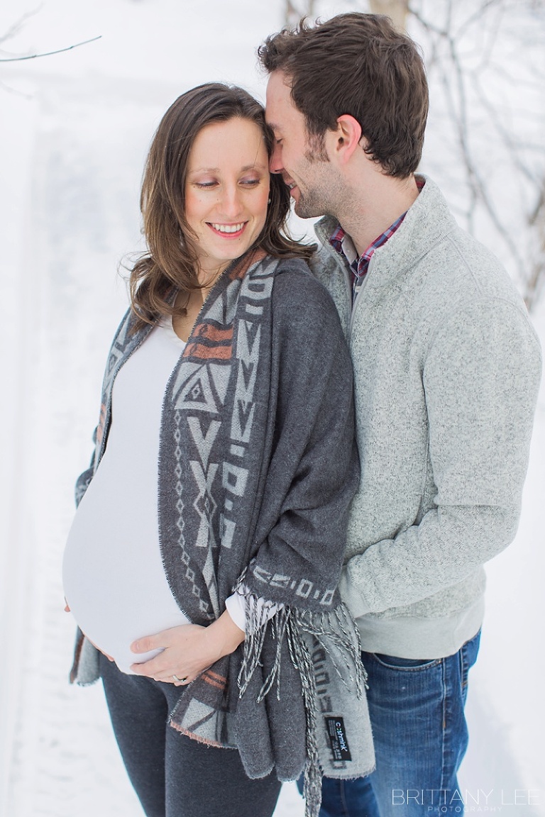 Mont Tremblant Winter Maternity Photos - couple standing in snow