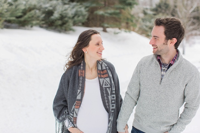 Mont Tremblant Winter Maternity Photos - pregnant couple walking in snow