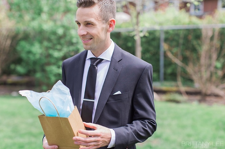 Groom opening gift from the Bride at Ottawa Wedding