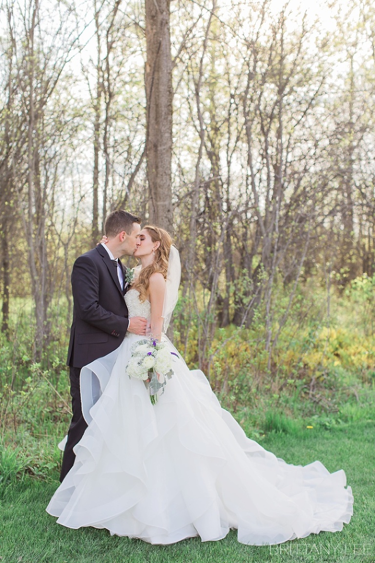 Bride and Groom Wedding photos outside Aquatopia Conservatory Carp Ontario