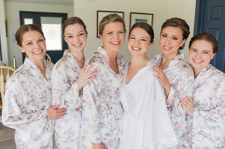 Bridesmaids wearing matching flower robes getting ready at ottawa wedding 