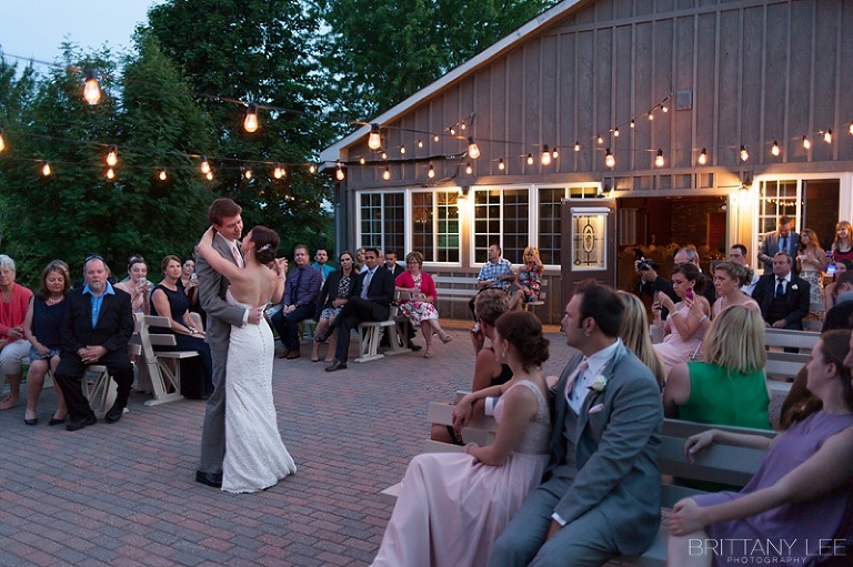 Bride and Groom first dance outside under twinkle lights at Strathmere Garden house wedding