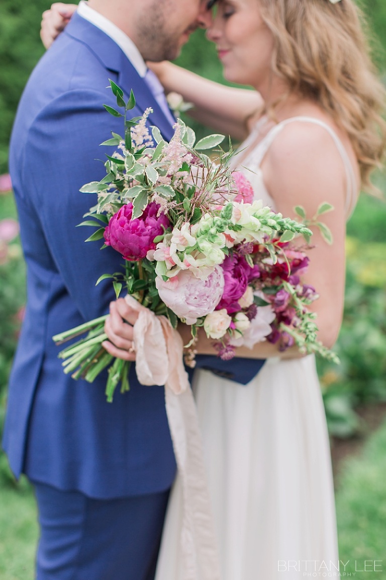 Bride and Groom first look at Ornamental Gardens in Ottawa - Bride in Custom Truvelle Gown