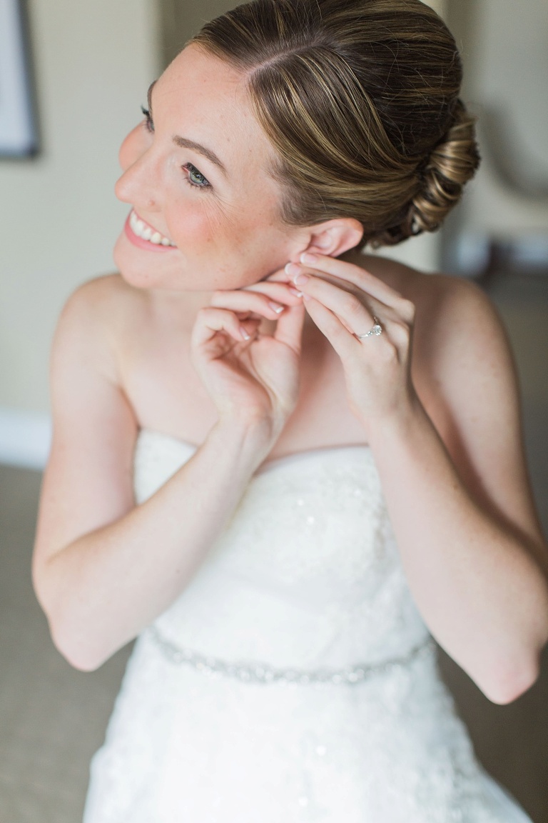 Mill Street Brew Pub Ottawa Wedding - Bride getting into wedding dress at Albert at Bay Suites
