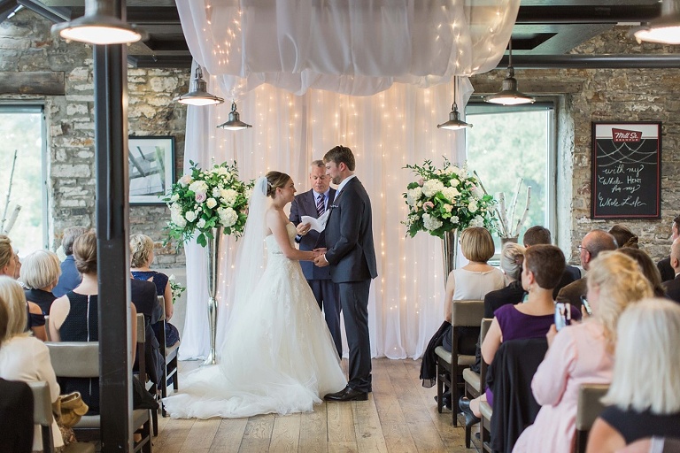 Mill Street Brew Pub Ottawa Wedding - Bride and Groom in front of white ceremony backdrop