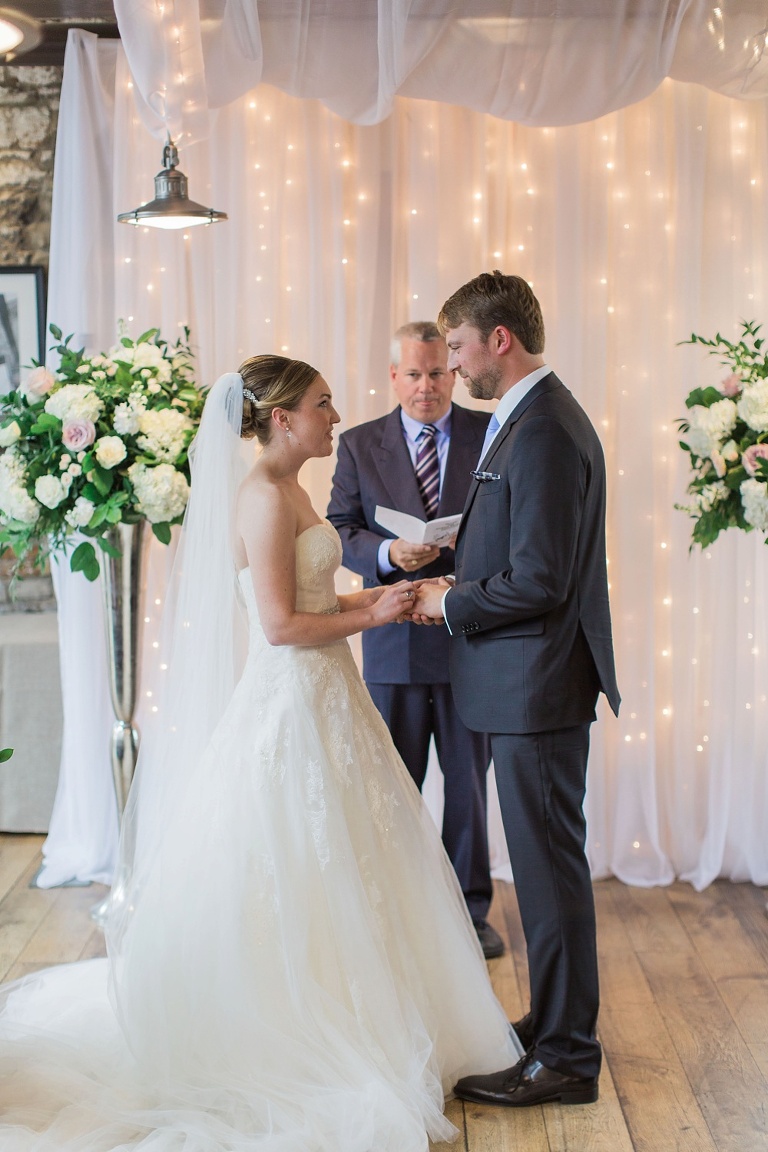 Mill Street Brew Pub Ottawa Wedding - Bride and Groom in front of white ceremony backdrop