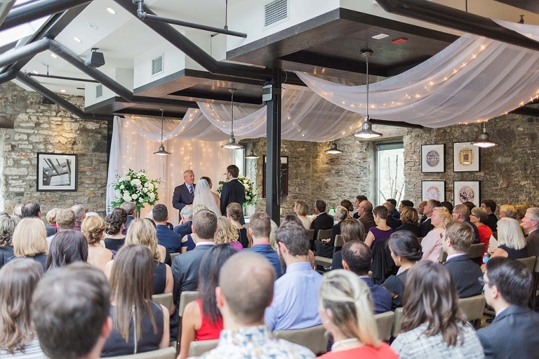 Mill Street Brew Pub Ottawa Wedding - Bride and Groom in front of white ceremony backdrop