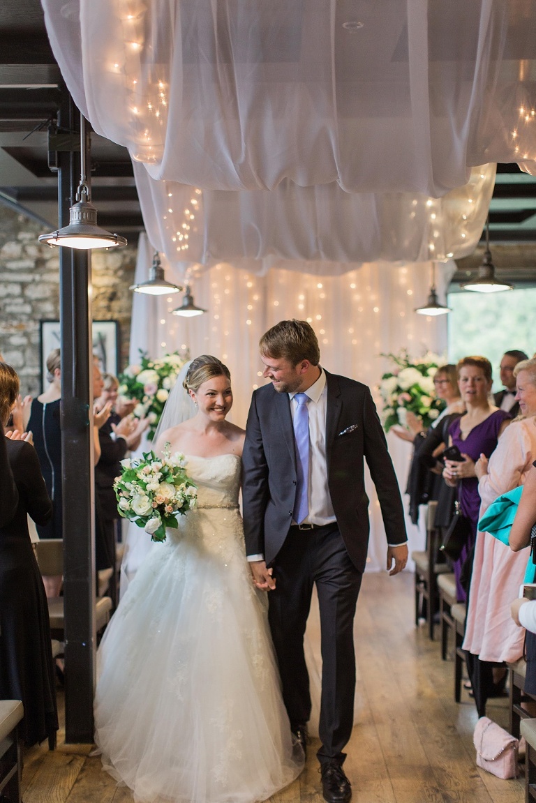 Mill Street Brew Pub Ottawa Wedding - Bride and Groom in front of white ceremony backdrop