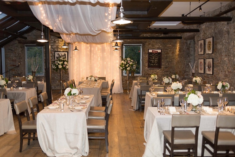 Mill Street Brew Pub Ottawa Wedding - Reception decor with white draping and floral arrangements