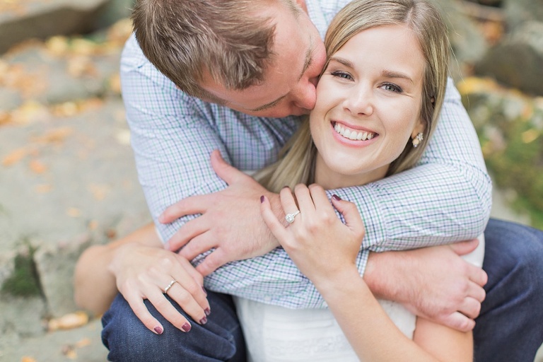 Wakefield fall engagement photos  - couple sitting on little wooden bridge
