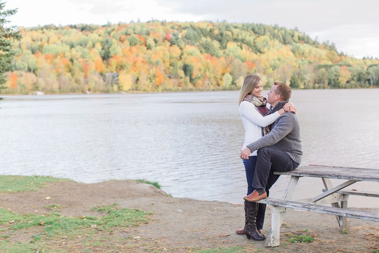 Wakefield fall engagement photos  - couple standing on rocks  along the river