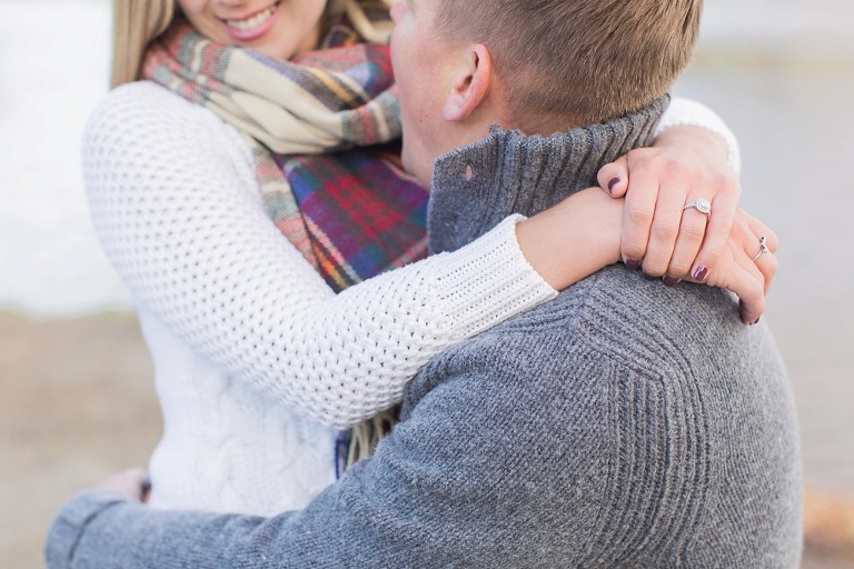 Wakefield fall engagement photos  - couple sitting on a bench by the river