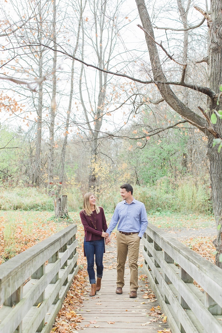 Stonebridge Trail Fall Engagement Session - Bride and Groom on walking bridge