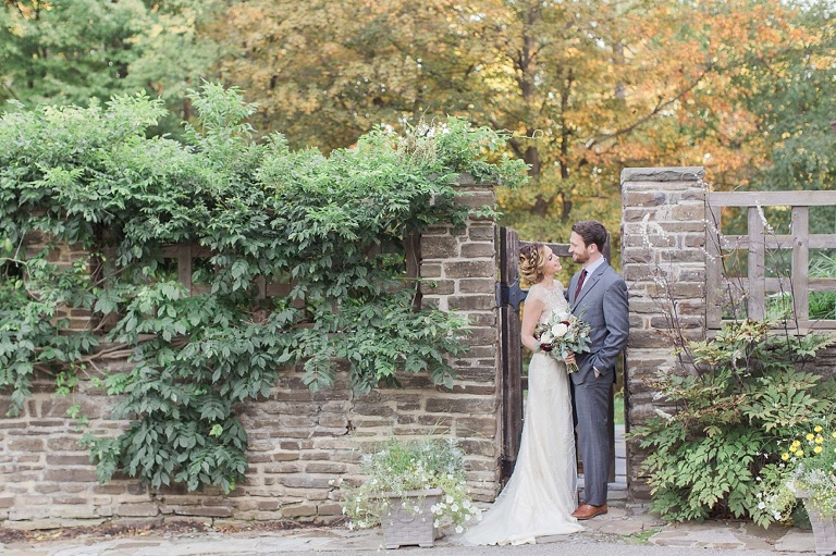Favourite Wedding Photos from 2016 - Bride and Groom standing at rustic brick wall after wedding