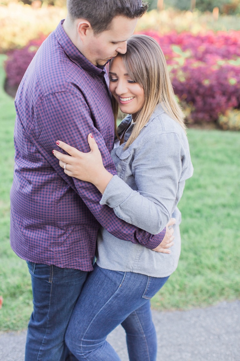 Favourite Engagement Photos from 2016 - Couple cuddled up at Dow's Lake in the fall