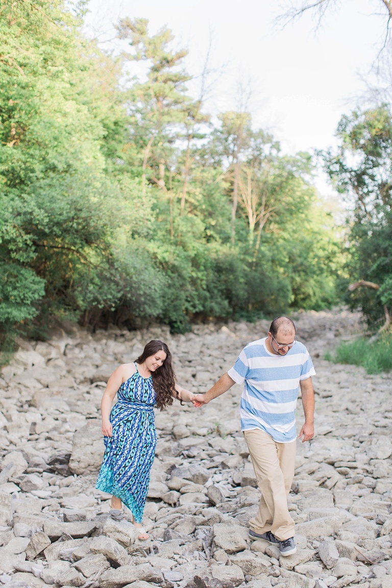 Favourite Engagement Photos from 2016 - Couple walking along stony river bed holding hands