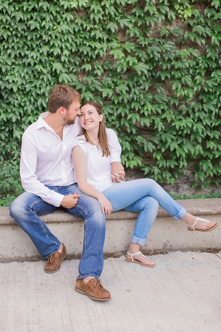 Favourite Engagement Photos from 2016 - Couple sitting together at Ottawa University building with wines