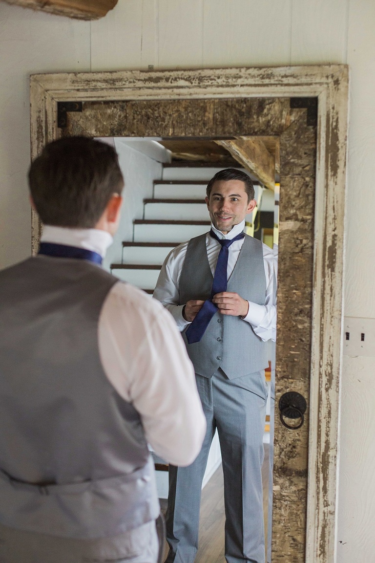 Stonefields Heritage Farm Wedding - groom getting ready in Farmhouse great room