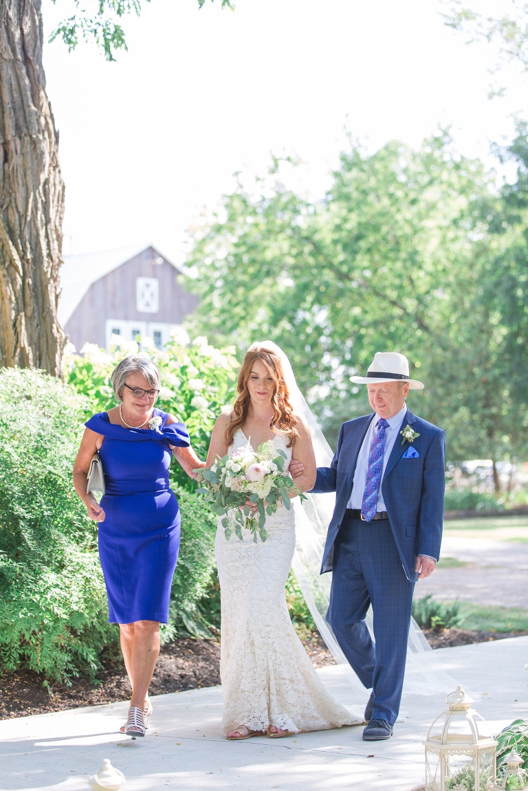 Ottawa Summer wedding at Stonefields Estate - outdoor ceremony with wooden arch