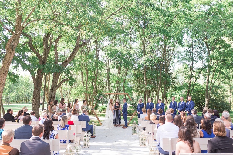 Ottawa Summer wedding at Stonefields Estate - outdoor ceremony with wooden arch