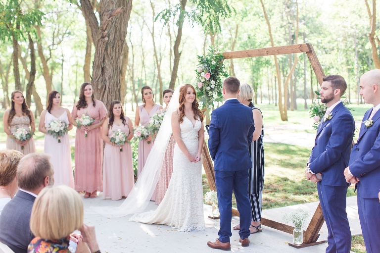 Ottawa Summer wedding at Stonefields Estate - outdoor ceremony with wooden arch