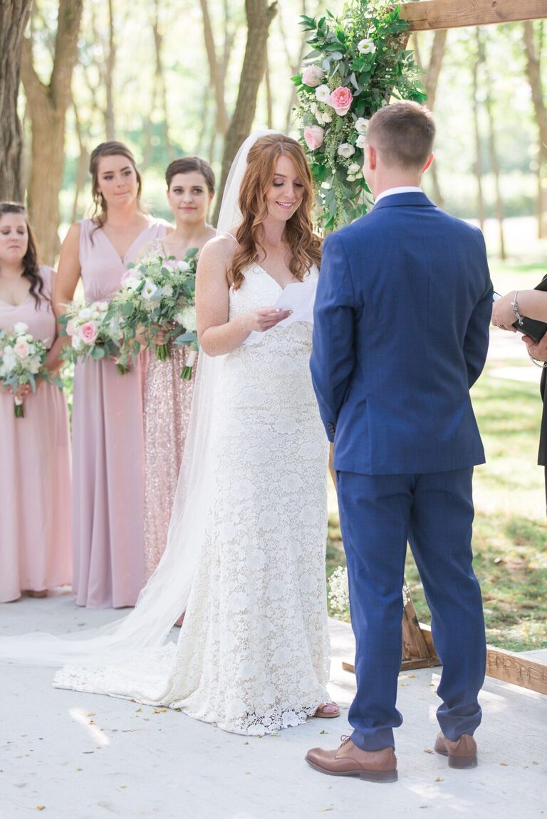 Ottawa Summer wedding at Stonefields Estate - outdoor ceremony with wooden arch