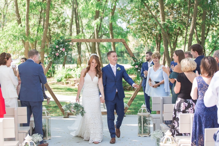 Ottawa Summer wedding at Stonefields Estate - outdoor ceremony with wooden arch